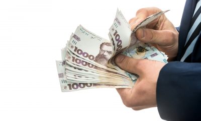 businessman made huge profits showing lot money man suit holds pack new banktons ukraine 1000 hryvnia