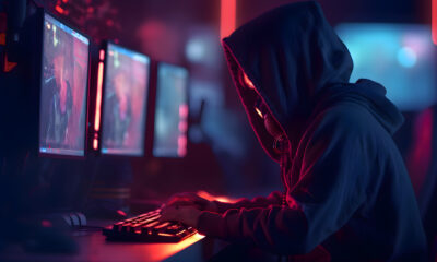 hacker hood stealing information from computer monitor cybercrime concept