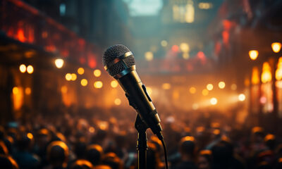 rock musician stage with microphone captivating adulating audience generated by artificial intelligence